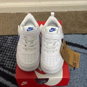 Nike Kids White Sneakers with Blue Accents